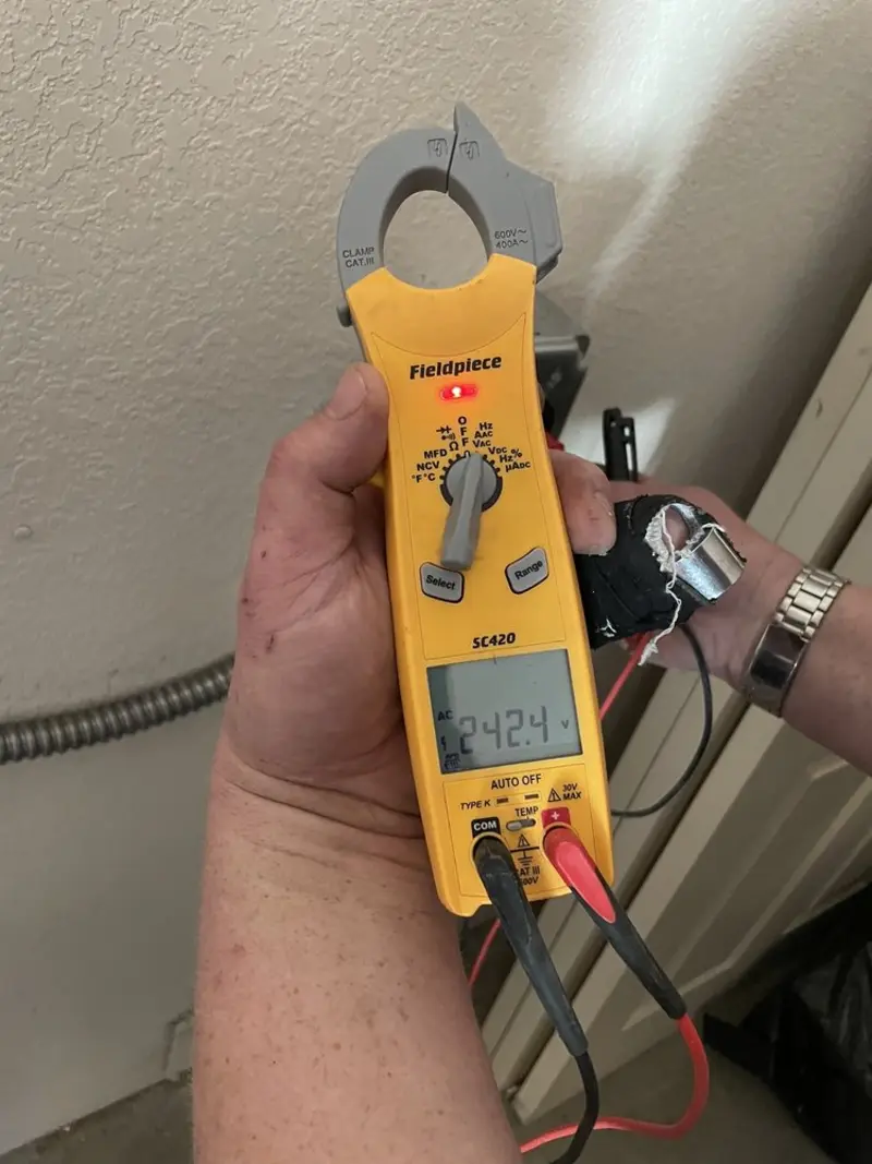 Voltage testing with clamp meter during Whole House Surge Protector in Hurst
